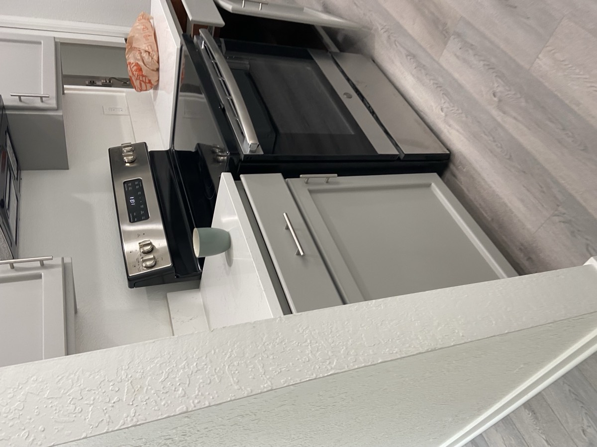 Kitchen cabinets refinished in soft gray