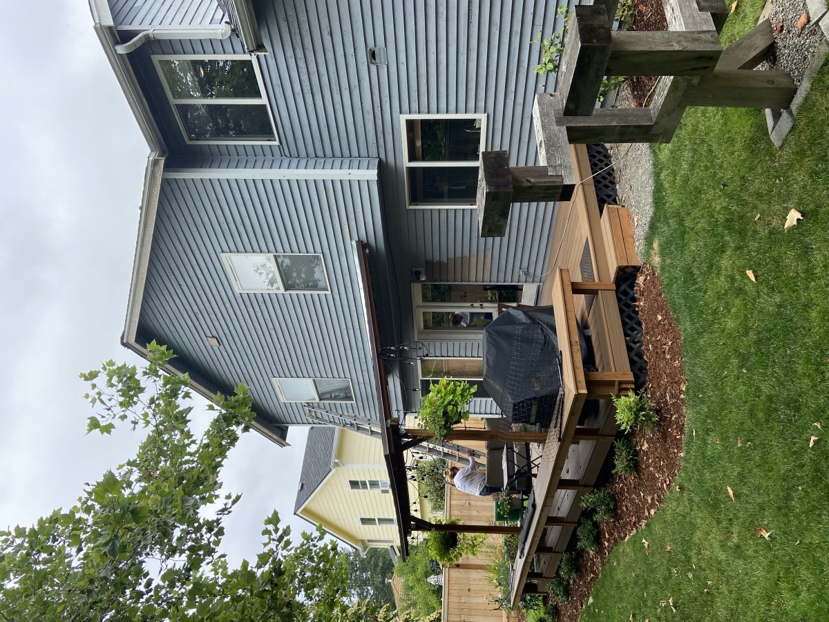 Rear exterior repaint with stained cedar deck and pergola